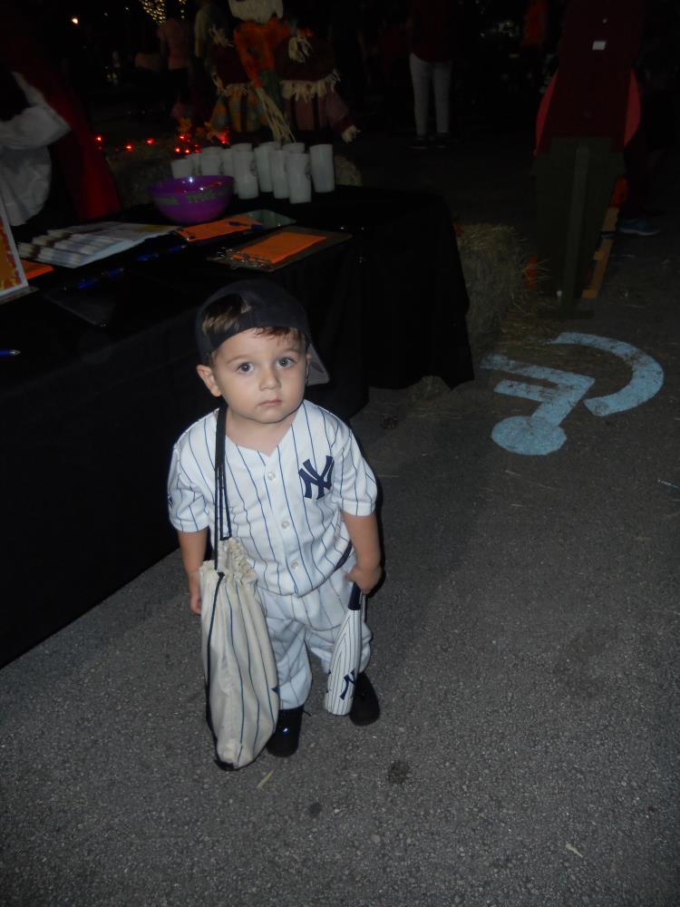 Boy dressed as New York Yankees baseball player